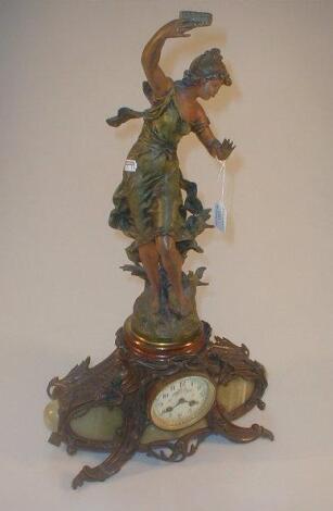 An early 20thC Art Nouveau painted Spelter and onyx mantel clock