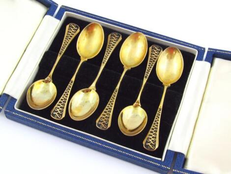 A set of Elizabeth II silver gilt and enamel finish spoons