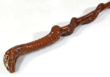 A heavily carved cobra wooden walking stick