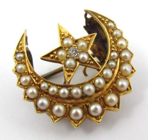 A late Victorian crescent and star brooch