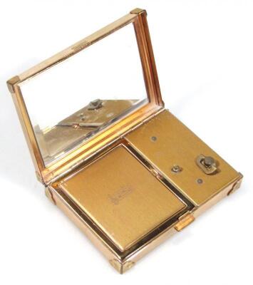 A mid 20thC metal powder compact with musical action - 2