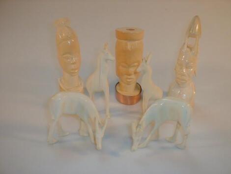 A group of ivory carvings including native heads