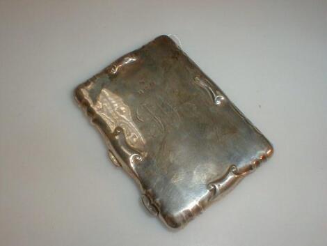 An Edwardian silver card case with fitted interior