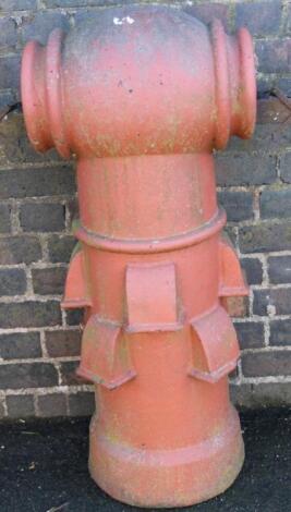 A redware vented chimney pot come planter