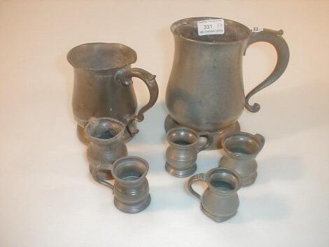 An old pewter baluster shaped mug