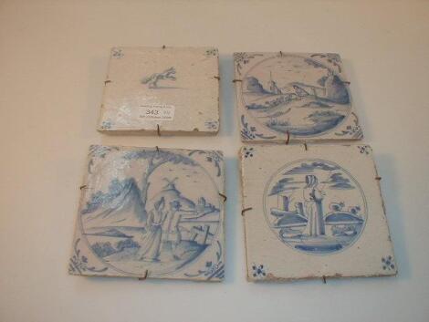 Four Delft tiles, including two similar tiles with rural scenes of figures