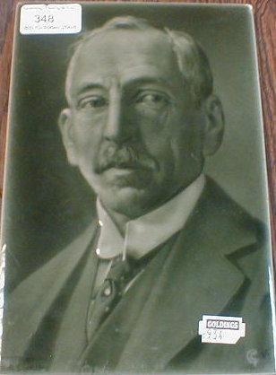 A grey glazed portrait tile - Mr W M Hughes