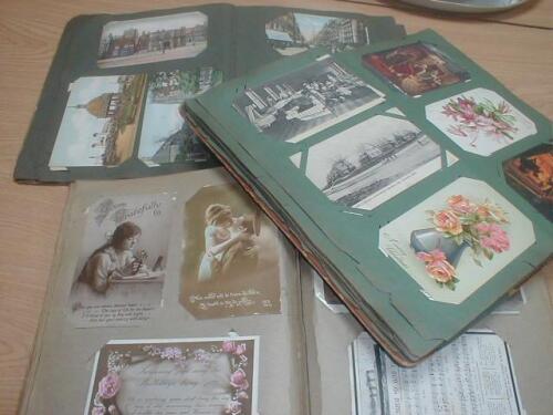 A collection of early 20thC postcards contained in three albums including