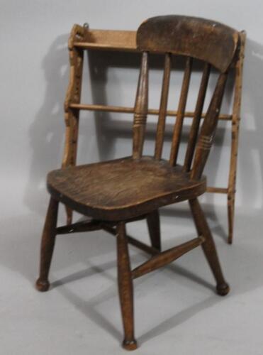 A very late 19thC child's combed back ash and elm chair