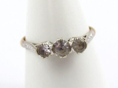 A three stone set dress ring