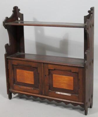 An early 20thC oak hanging cabinet