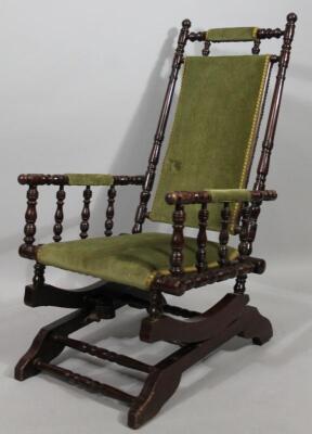 An early 20thC stained American style rocking chair