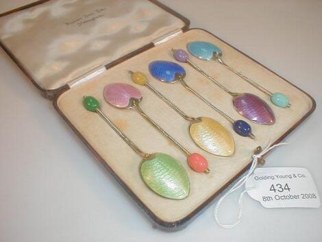 A set of six George V silver and enamelled coffee spoons