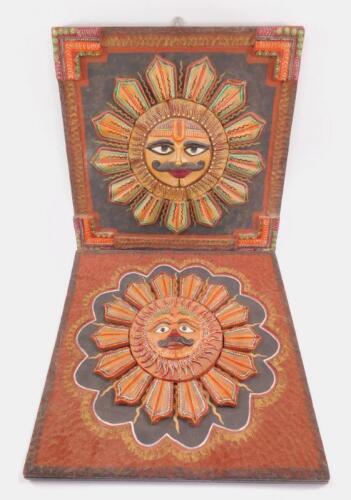 A pair of 20thC Mayan plaster Sun God wall plaques