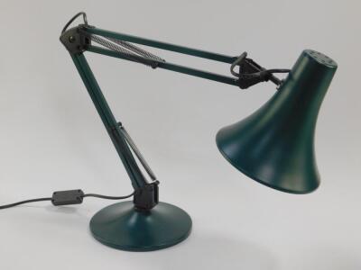 A green anglepoise table lamp