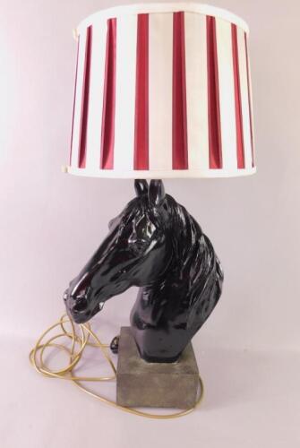 A black plaster table lamp modelled as a horse's head
