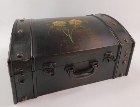 A black stained plywood casket