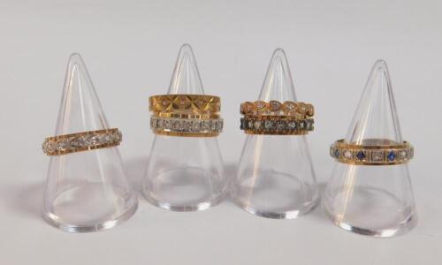 Six 9ct gold and gem set full eternity rings