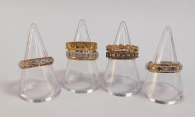 Six 9ct gold and gem set full eternity rings