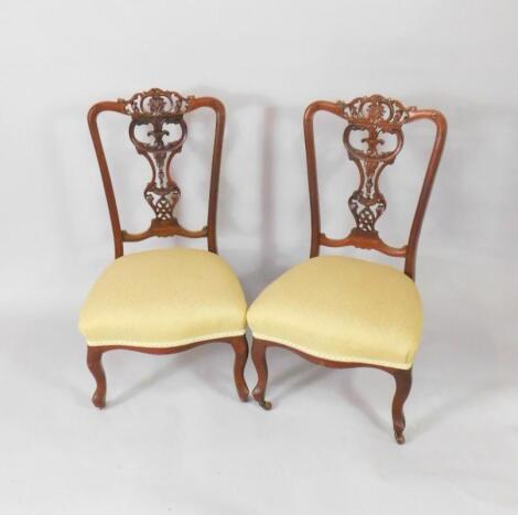 A pair of Victorian mahogany nursing chairs