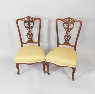 A pair of Victorian mahogany nursing chairs