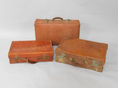 A tan leather suitcase