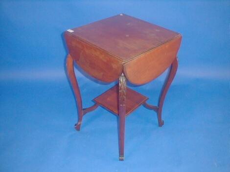 A late Victorian walnut occasional table with folding top