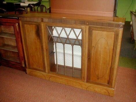 An Edwardian string inlaid bleached mahogany three door side cabinet with