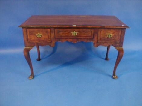 A Queen Anne style three drawer side table with cross banded and herringbone