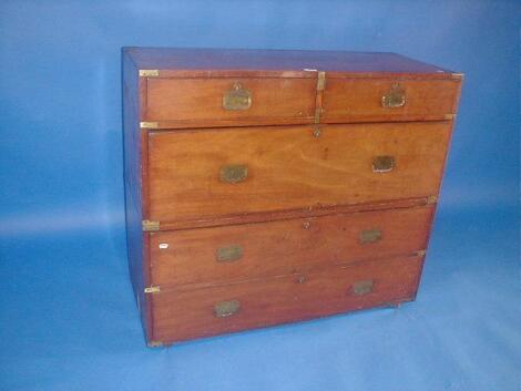 A mid 19thC teak campaign chest with oak lined drawers and brass mounts