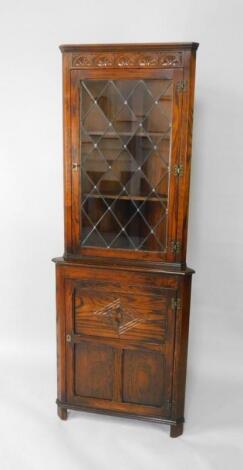 A JC oak corner cupboard