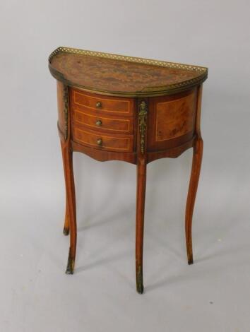 A Louis XVI style French mahogany and inlaid demi-lune side table