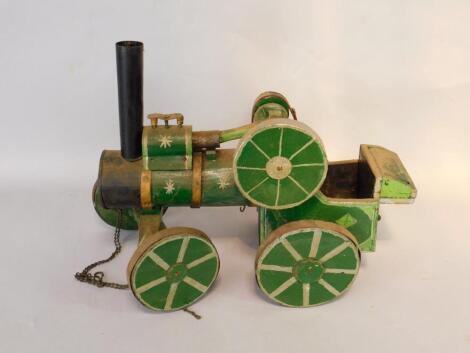 A green painted wooden model of a steam traction engine