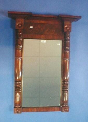 A Victorian flamed mahogany pier glass with rectangular plate and turned insert columns