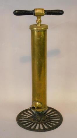 An Enots late 19thC brass and cast iron floor standing fire extinguisher