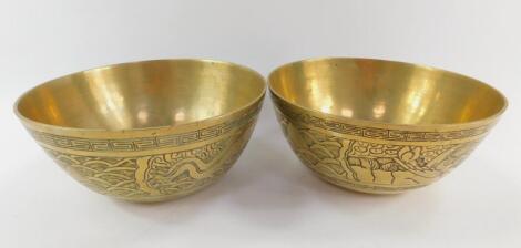 A pair of Chinese polished bronze bowls