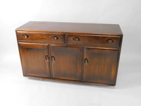 An Ercol oak sideboard