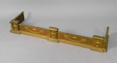 An Edwardian Adam style brass fender