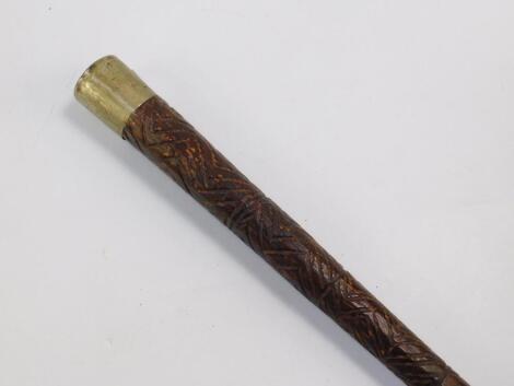 A carved wooden walking stick