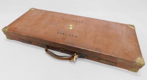 A James Purdey and Sons leather and brass bound shot gun case