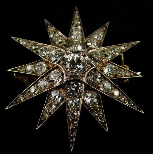 A diamond star brooch/pendant