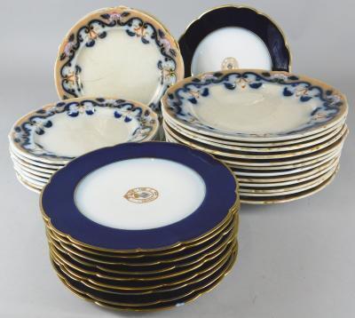 A part set of Limoges porcelain armorial plates