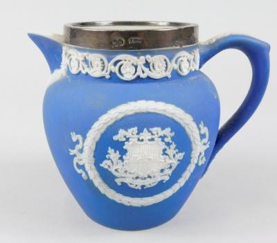 An early 20thC Adam's Lincoln blue Jasperware jug