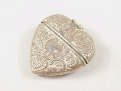 An early 20thC miniature heart shaped case