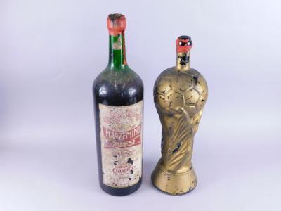 An oversized bottle of Marzemino Di Ziresi partially sealed