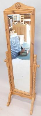 A modern reclaimed pine cheval mirror