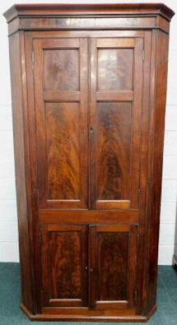 A Victorian mahogany standing corner cupboard