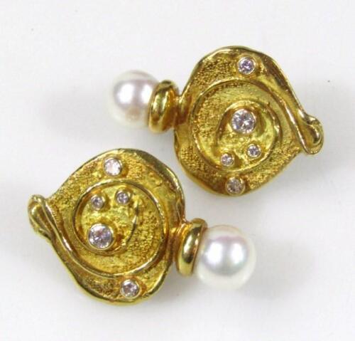 A pair of 18ct gold diamond and pearl earrings