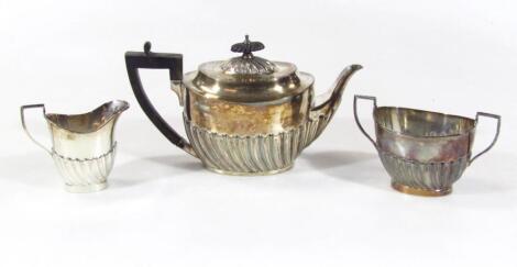 A Victorian silver three piece bachelor's tea service