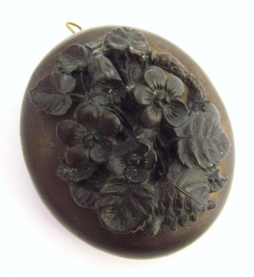 A 19thC polished jet style pendant locket